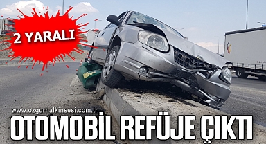 Refüje çıkan otomobildeki 2 kişi yaralandı