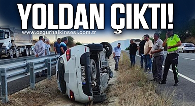 Yoldan çıkan otomobil yan yattı