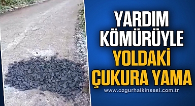 YARDIM KÖMÜRÜYLE YOLDAKİ ÇUKURA YAMA