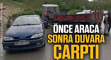 Islak yolda kayan traktör otomobile ardından duvara çarptı
