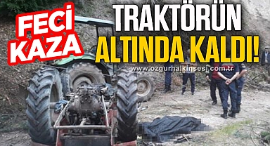 Devrilen traktörün altında kaldı