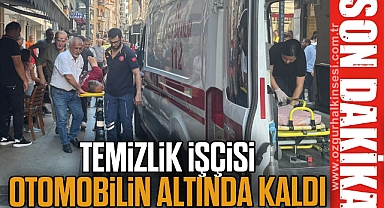 Temizlik işçisi otomobilin altında kaldı