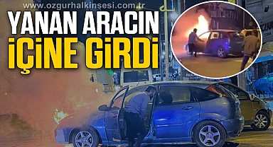 Cep telefonunu almak için yanan aracın içine girdi