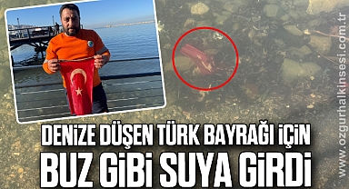 Denize düşen Türk bayrağı için buz gibi suya girdi