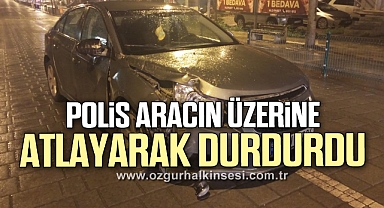 Polis alkollü sürücüyü aracın üzerine atlayarak durdurdu