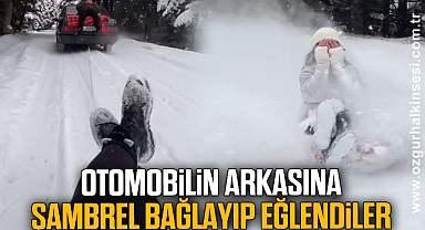 Otomobilin arkasına şambrel bağlayıp, eğlendiler