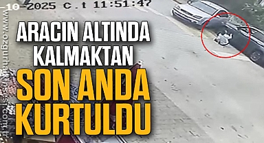 Aracın altında kalmaktan son anda kurtuldu
