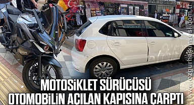 Motosiklet sürücüsü, otomobilin açılan kapısına çarptı