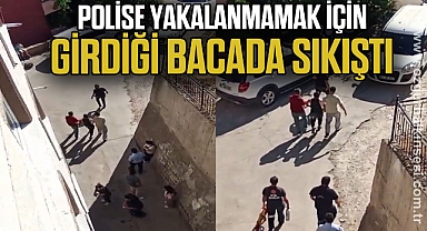 Polise yakalanmamak için girdiği bacada sıkıştı