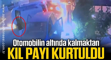 Otomobilin altında kalmaktan kıl payı kurtuldu
