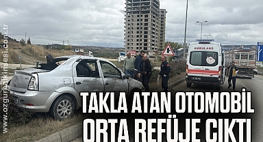 Takla atan otomobil orta refüje çıktı