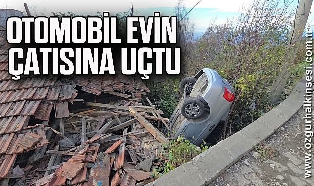 Otomobil evin çatısına uçtu