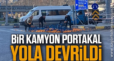 BİR KAMYON PORTAKAL YOLA DEVRİLDİ