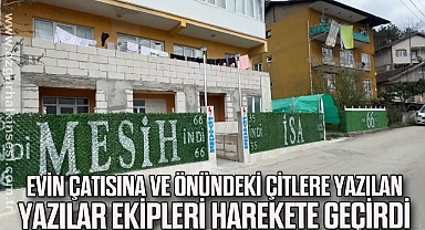 Evin çatısına ve önündeki çitlere yazılan yazılar ekipleri harekete geçirdi