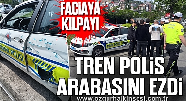 FACİAYA KILPAYI: TREN POLİS ARABASINI EZDİ