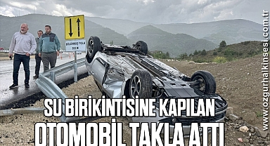 Su birikintisine kapılan otomobil takla attı